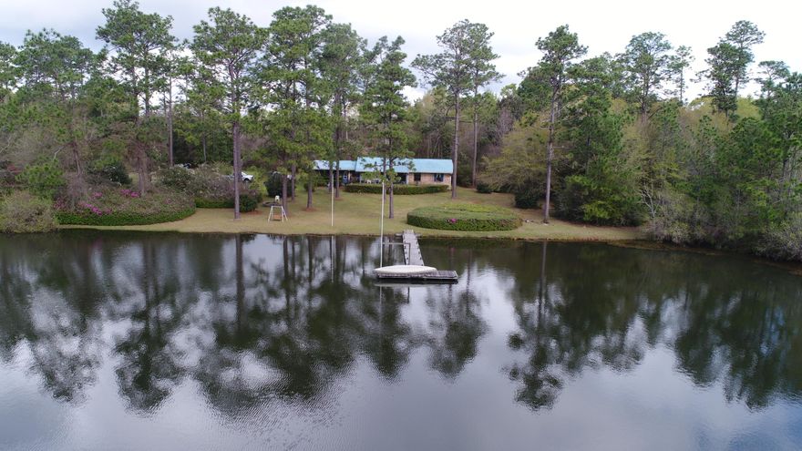 Welcome to your new private country estate featuring a breathtaking lake and nearly 300 unspoiled acres with Blackwater forest on two sides! Only 5 miles north of Baker and 40 minutes to the pristine beaches of Destin and south Walton, this is the best of both worlds. Privacy abounds beginning on the nearly half mile drive down the private entrance flanked by dogwoods, and azalea. Cozy and comfortable country home featuring 3 bedrooms and 2.5 baths with a roomy covered porch off of the back and overlooking a beautiful lake that will quiet the restless mind. Bring your horses, ATV's and your imagination. Property features approx 15-18 acres of pasture with the remaining acreage in timber and the added bonus of state forest on two sides. A truly unique slice of Baker's finest land!