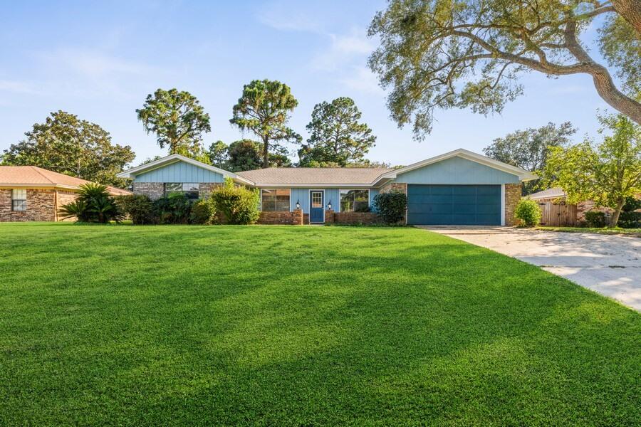 NEW roof, hvac, flooring, kitchen, paint, & more!!Spacious & inviting!! As you enter the home you are welcomed by a gorgeous brick flooring followed by vinyl planking. To your left you have a office space or den and to your right a formal dining space that flows right into the kitchen! The kitchen is updated with new granite countertops throughout & white shaker cabinets. It also has new stainless steel appliances and fixtures. The open floor plan allows the already oversized space to feel that much bigger. The bedrooms are a split floor plan an VERY spacious. The 3 guest bedrooms are on one side sharing a bathroom. The main bedroom has a private en suite. With a dreamy oversized laundry room! The covered back porch feels like perfection with the beautiful foilage! This is not one to miss