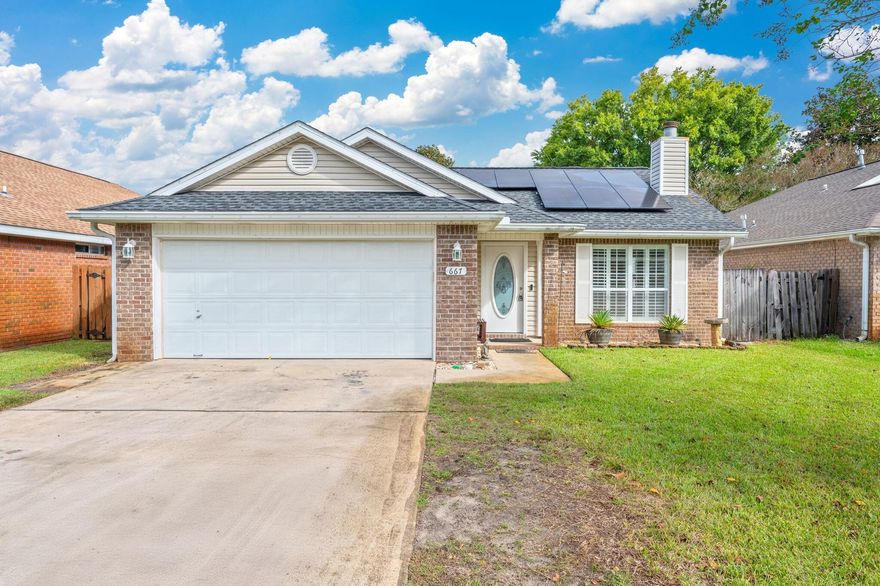 This beautifully updated Florida home combines modern comfort with timeless charm. Step inside to a warm and inviting living room featuring plantation shutters, custom built-in shelving, and a cozy gas fireplace- the perfect place to relax or gather with family. The open-concept kitchen is ideal for entertaining, complete with stainless steel appliances, granite countertops, and seamless flow into the dining and living areas. A converted back patio now serves as a bright and airy enclosed Florida room, providing additional year-round living space. The spacious master suite offers a newly renovated ensuite bathroom and a generous walk-in closet, while two additional bedrooms and a full bathroom are conveniently located just down the hall. Additional features include an interior laundry room, a two-car garage, and a lush, fully fenced backyard- perfect for pets, play, or quiet evenings outdoors. Energy efficiency is a key highlight, with a natural gas furnace and water heater, as well as solar panels installed in 2021 to help reduce utility costs. 
Move-in ready and thoughtfully updated, this home is ready to welcome its next owner! 
Convenient to military bases and our beautiful Emerald Coast beaches. Roof 2020, water heater 2020, HVAC 2014.