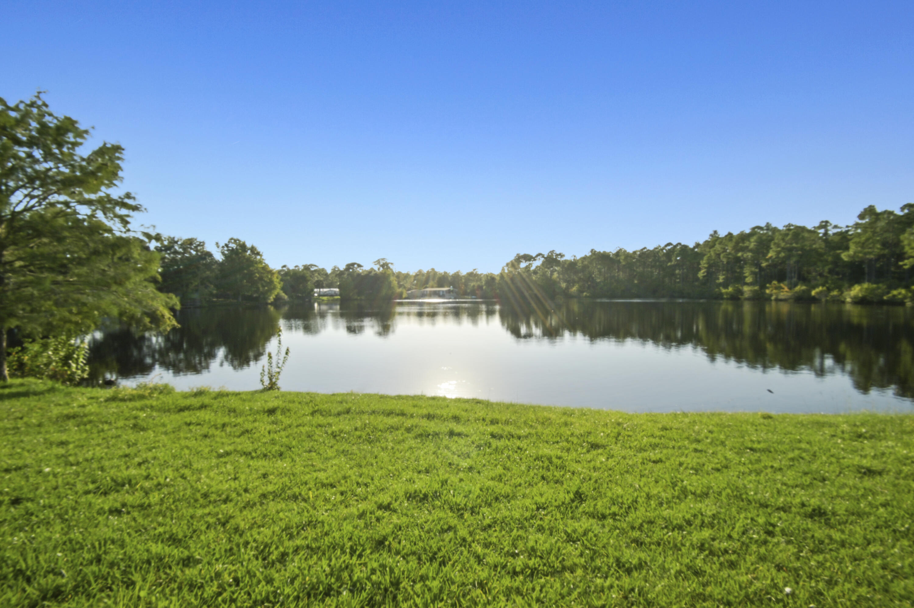 This LAKEFRONT home offers breathtaking views and a spacious interior! Perfectly maintained by the original owners for 40 years, this home is ready for its new story! When you pull up, you're welcomed by an abundance of parking, a large lot, and the beautiful sparkling water of the lake out back. Stepping up to the front door, take note of the large, covered porch. Heading inside you are welcomed by the dining area, kitchen, and living room - all offering breathtaking lake views. The master bedroom is huge with an en suite bathroom and walk in closet, and the additional bedrooms share a bathroom in the hallway. The foyer offers the perfect secondary living space by the front door. The crown jewel of this house is its sunroom offering the perfect space for relaxing with a coffee or tea overlooking the lake. You do not want to miss this home, stop on by and make your waterfront dreams come true!