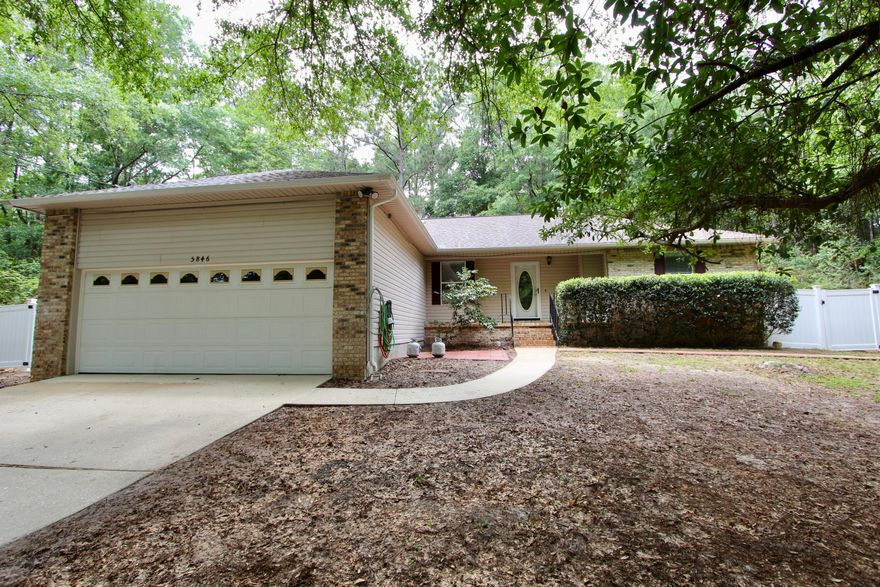 Situated on a tranquil 1-acre lot in Crestview, this inviting 3-bedroom, 2-bathroom residence offers a harmonious blend of comfort and functionality. The home features a partially privacy-fenced backyard with gates, complemented by an additional smaller fenced section--ideal for pets, gardening, or creating a private retreat. A bonus storage area provides ample space for your needs, while the hot tub offers a relaxing escape. Additional highlights include an air-conditioned shed, perfect for a workshop or studio, and an extra utility shed offering ample storage space for tools, equipment, or seasonal items. The garage is pre-wired for an electric vehicle (EV) charging station. Brand new water heater.  AC 2018. Roof 2021