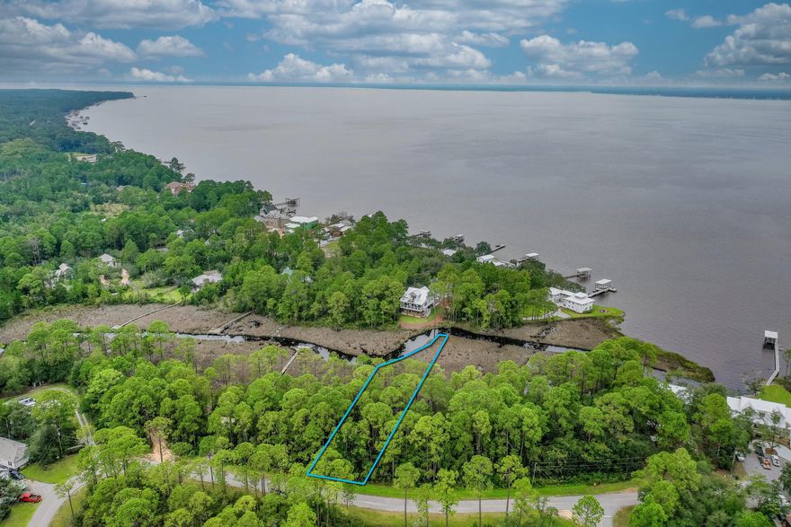 Build your new home in Pisces Cove on this large canal WATERFRONT lot just a short paddle out to Choctawhatchee Bay, located in North Santa Rosa Beach of Walton County. Enjoy all of the 331 fun - recreational area with a boat launce, fishing pier, pavilions for picnics and multiple restaurants close by. Possible bay views from upper stories! All information contained in the listing is believed to be accurate but not guaranteed.