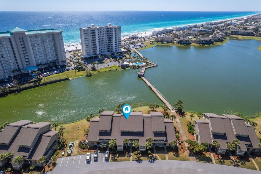 Over $22K In reservations on the books for 2026. MOTIVATED SELLER! Sharp $25K price drop to $650,000 on this turn-key, lakefront 3BR/3BA townhome in Seascape Resort. Proven $60K-$68K+ gross rental income annually with 2026 already pacing +18%. Identical unit next door sold $675K in July. Delivered fully furnished & rental-ready - future bookings, financials & mgmt transfer at closing. Direct Stewart Lake views, steps to 2,000 ft of deeded beach, pools, golf, tennis & Whale's Tail. Rare 3 full baths, ground-floor BR, sleeps 8-10 easily. Low $650/mo HOA covers everything. Best priced, highest-producing lakefront 3/3 in Seascape today. Seller says SELL - bring offers! Take a quick, easy walk to enjoy your deeded beach access, a provision exclusive for Seascape residents. Indulge in endless afternoons under the sun, against a backdrop of serene- Gulf views that are only steps away. Residing here means having the power to enrich your every day with an invigorating and opulent coastal lifestyle.The Seascape Resort is a well-established community known for its generous amenities and vibrant social scene. Engage in a friendly match on the Tennis or Pickle Ball courts, challenge your friends at a round of golf, or simply let loose at one of the lively resort concerts. Your options for leisure or recreation are boundless. Situated close to the beach, this condo guarantees seaside living at its finest - where every day feels like a vacation. Don't miss the chance to own a piece of this charming paradise. Get in touch today to schedule a showing, and see for yourself the promise of unrivaled luxury and leisure that this Condo holds.