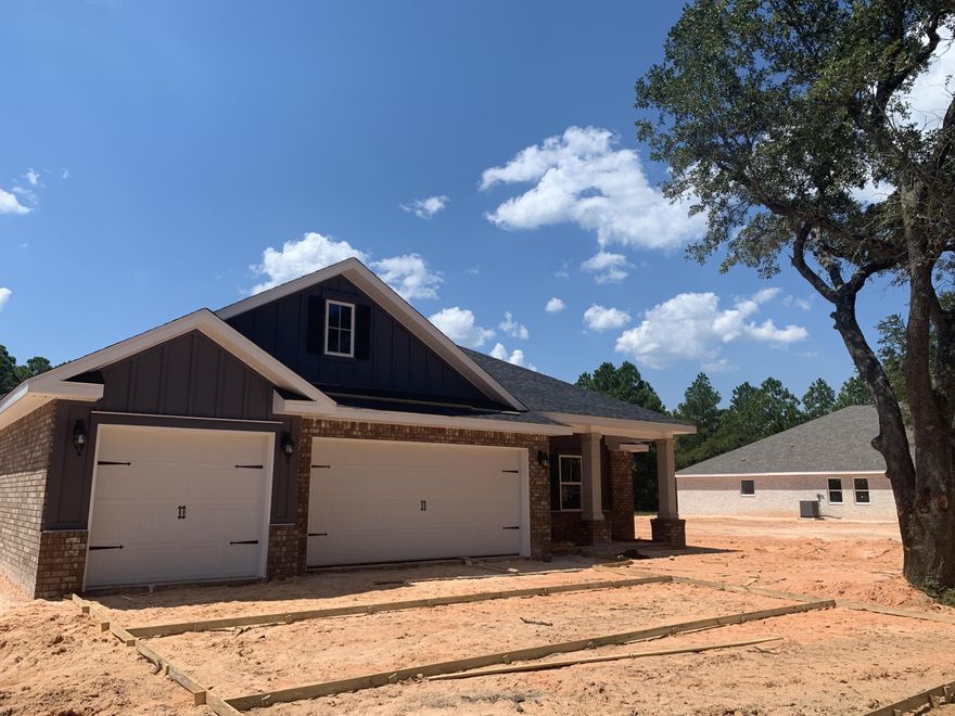 *COMPLETE & READY DECEMBER 2019* Please TEXT Agent for construction status.**Brand New Floor Plan & Location central to everything! 7 miles from Navarre Beach Bridge and 12 miles to 1-10 *4 Bedrooms *Dining can double as an Office /Playroom *Open Floor plan *3 Full Baths * 3 Car Garage * Lot is 1/4 acre on sewer * Covered Entry *Mohawk Luxury Wood Vinyl Plank in Formal Areas/Wet Areas *Mohawk Carpet in Bedrooms * *Dbl Trey Ceiling in Master Bedroom *Soaking tub & Builder's Signature Walk in Tile Shower in Master Bath *Kitchen has Huge Walk in Pantry, Granite Countertops & Large Island *Stainless Steel Appliances *Spacious Family Room with 10 Ft Flat Ceilings & Double Trey &*Eglass Windows look onto the Rear Yard * Large Lanai with 10' ceiling & ceiling fan/light combo. *Builders Warranty