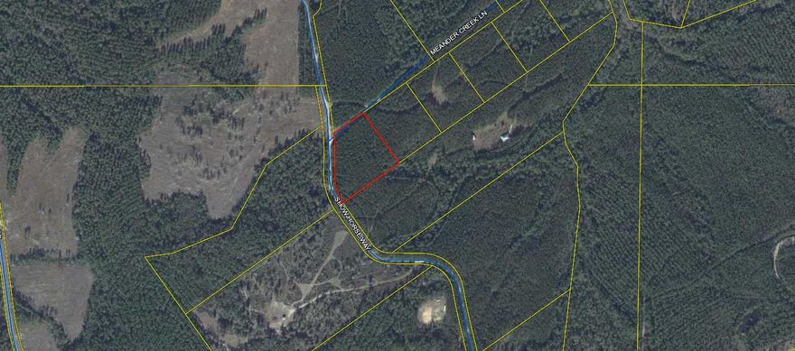 Come and enjoy your own piece of nature inside a gated community. This property is a wooded corner lot and is ready for you to make it yours. The community was designed for outdoor people with private ponds, an extra 1000 acres for hunting, ATV trails, a chapel, community restrooms, and a community garden. This community has a lot to offer for the people who want to feel secure but out in nature. At the end of the road there is a small creek to cool off in during the summer months. Come check this property out you will not be disappointed.