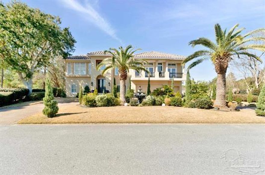 Tucked inside a private gated enclave in the heart of Gulf Breeze, 2 Colley Cove delivers an extraordinary blend of coastal elegance, innovation, and lifestyle. Just minutes from the Gulf of America, top-rated schools, premier shopping and dining, and the sugar-white beaches of Pensacola Beach, this home offers the rare balance of privacy and convenience buyers are searching for.Designed for both grand entertaining and effortless everyday living, the thoughtfully crafted floor plan showcases soaring ceilings, abundant natural light, and warm coastal tones throughout. Travertine natural stone floors, decorative black iron railings framing beautiful wood staircases, surround sound, and luxurious finishes create a refined yet inviting atmosphere.