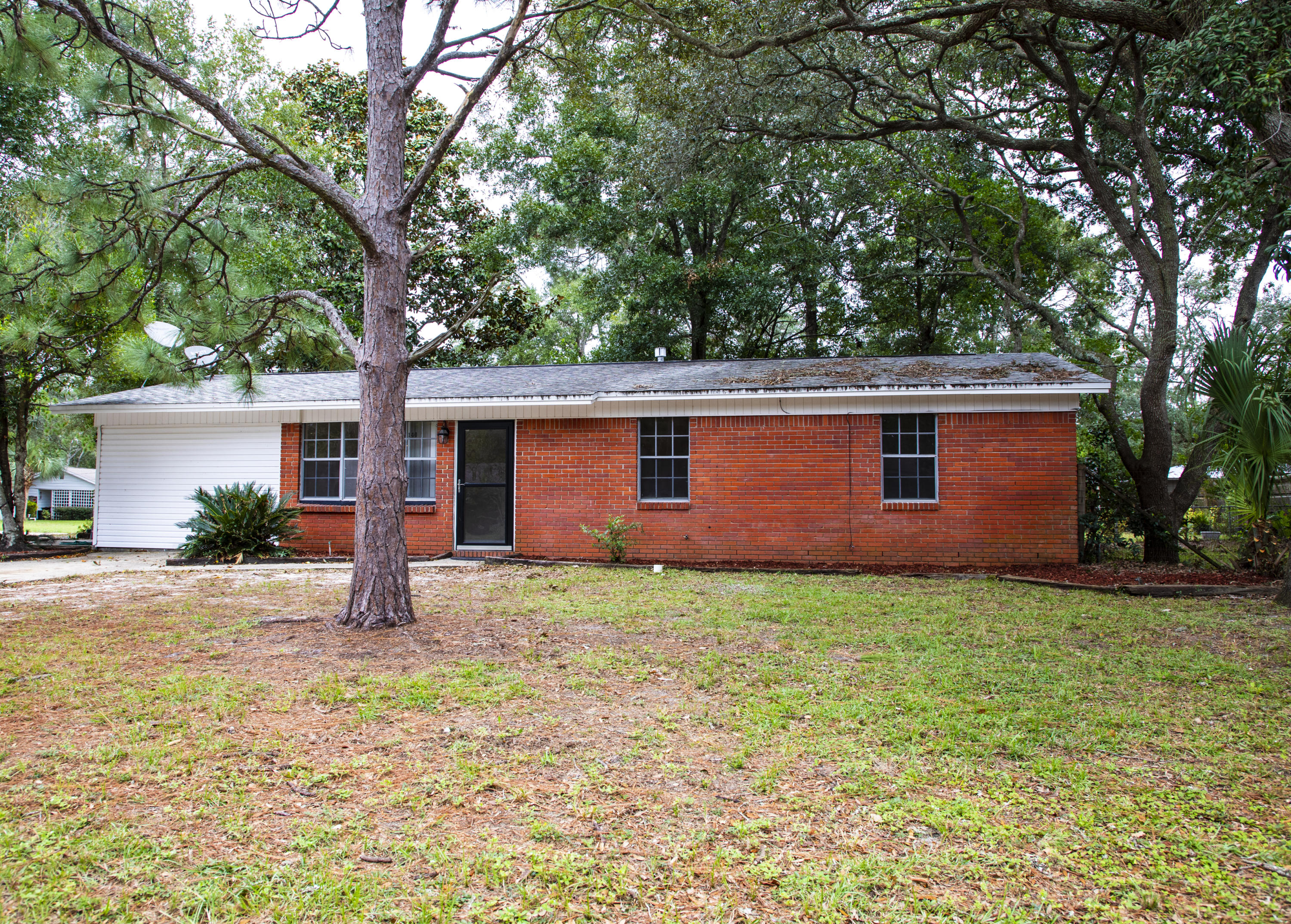 Corner Lot. All brick 3 bedrooms and 2 bathrooms home with 2 living areas. Inside of the home was just painted. The bathrooms and kitchen has been updated. Tile through out the entire home. NO Carpet. When you first walk into your home you are in the living area. Kitchen is to the back of the home. Family room is to the left. Sliding glass door in the family room makes the family room bright and accessible to the outside patio. Great for entertaining the family or BBQ.s. Bedrooms and bathrooms are to the right of the living room. You will not be disappointed. Inside Laundry room is in the back of the family room. Large corner lot. Lawn pump sold as is.