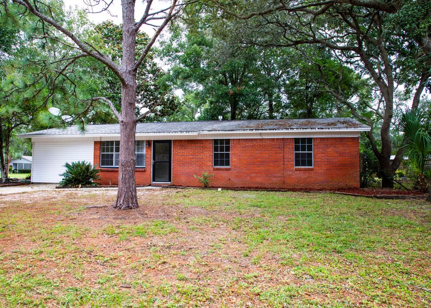 Corner Lot.  All brick 3 bedrooms and 2 bathrooms home with 2 living areas. Inside of the home was just painted.  The bathrooms and kitchen has been updated.  Tile through out the entire home. NO Carpet.  When you first walk into your home you are in the living area.  Kitchen is to the back of the home.  Family room is to the left.  Sliding glass door in the family room makes the family room bright and accessible to the outside patio. Great for entertaining the family or BBQ.s.  Bedrooms and bathrooms are to the right of the living room.  You will not be disappointed. Inside Laundry room is in the back of the family room.  Large corner lot.  Lawn pump sold as is.
