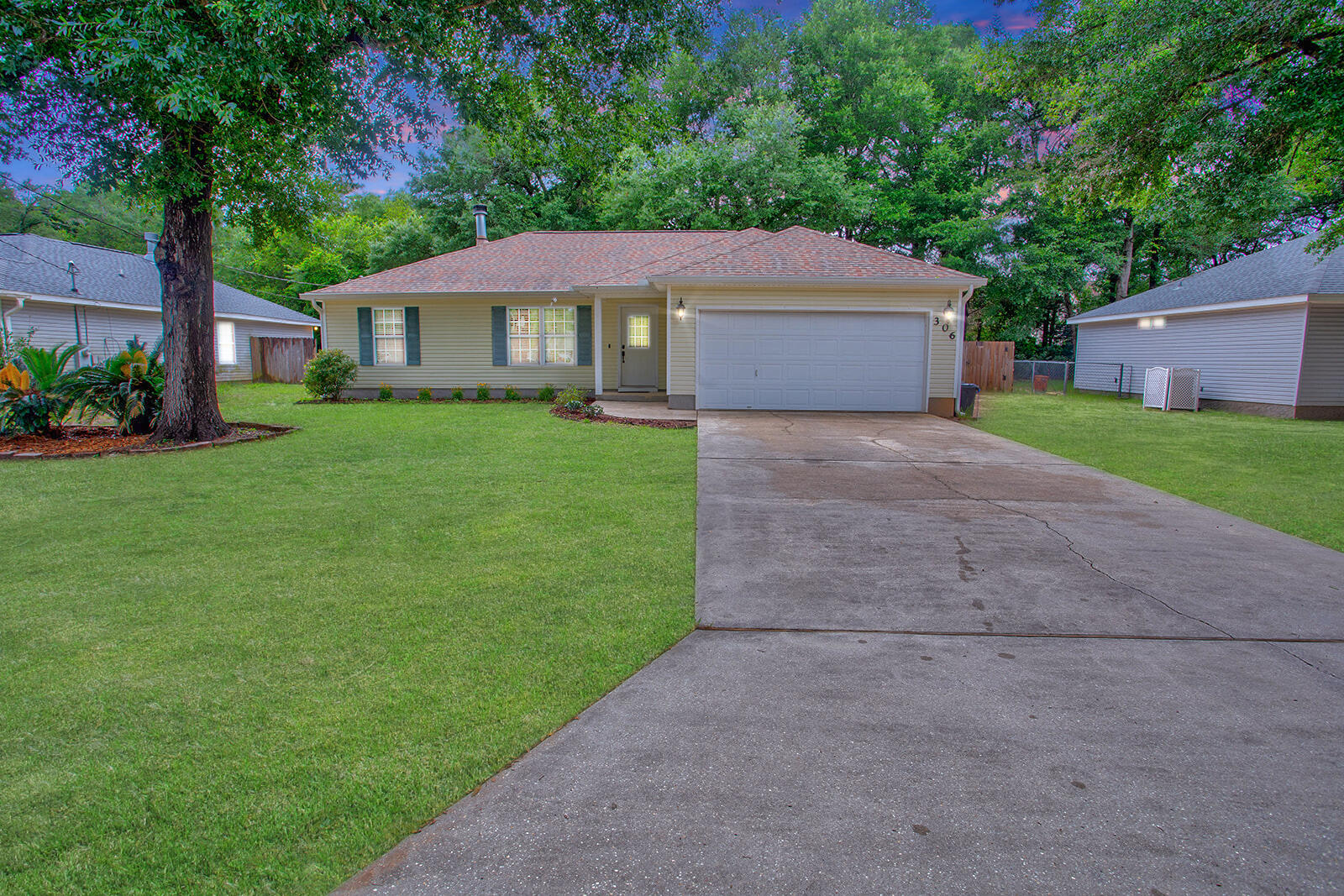 ****CHARMING*** Located in the desirable Winding Creek Estates, this well-maintained home offers a split floor plan with three bedrooms, two bathrooms, and a two-car garage. Step into the spacious Great Room featuring a cozy WOOD FIREPLACE and soaring CATHEDRAL CEILING for a bright, airy feel. The home boasts durable LAMINATE FLOORING in common areas and has been FRESHLY PAINTED throughout. The two guest bedrooms and full bath with NEW TOILETS sit on one side, while the private master suite is on the other. The kitchen includes a NEW REFRIGERATOR, and a NEW WASHER/DRYER set is included. Enjoy energy efficiency with HEAVY INSULATION and a REFURBISHED AIR CONDITIONER. A French door opens to the back patio, and the ROOF was replaced in 2019. This move-in ready gem won't last lonn!!