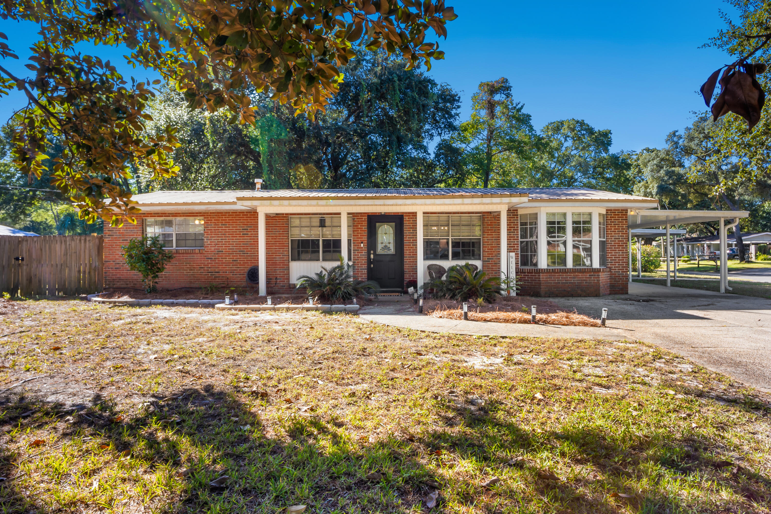 Walk into this charming one story, open concept home and you will feel so welcome. Its cozy yet useful floor plan makes the best possible use of the space. Not only do you have a spacious main living room but you also have another living room/entertaining room to use as a secondary gathering spot or a playroom. Check out the fully fenced in yard and carport for getting out of the rain. Just minutes to Hurlburt and all that downtown Fort Walton has to offer. Come check it out!