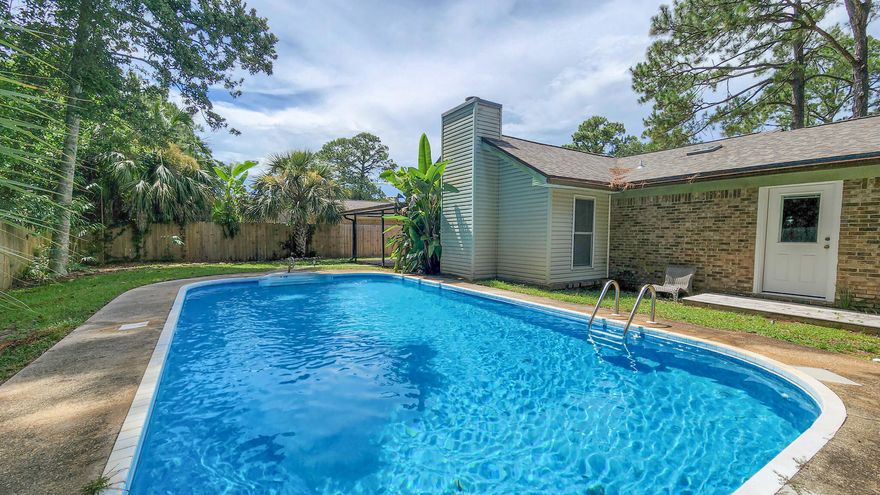 BEAUTIFUL BRICK HOME + IN GROUND POOL in central Fort Walton Beach, just minutes from all things shopping, dining, etc. Enter through the front door to a large open living space, with tile flooring, cathedral ceiling, statement brick fireplace and wood columns leading into the formal dining area that give the room character. Spacious U-shaped kitchen with large window over the sink looking into the backyard. Breakfast nook sits beside the kitchen and has a door that leads out to the 2- car garage. Laundry hookup + water heater located in garage as well. Master bedroom looks out toward the pool, and has room for a sitting area ... master bathroom has double vanity, water closet, and walk-in closet. Two guest bedrooms and full guest bath occupy the west end of the home. Outside in the backyard, enjoy relaxing evenings on your 19' x 8' covered patio, or take a swim in the private in-ground pool... lawn in front and back is nicely maintained and enough room for kids / pets / etc to play ... Home also has a nice size covered front porch.

HVAC est. 2004. Roof 2021. Water Heater 2019.
