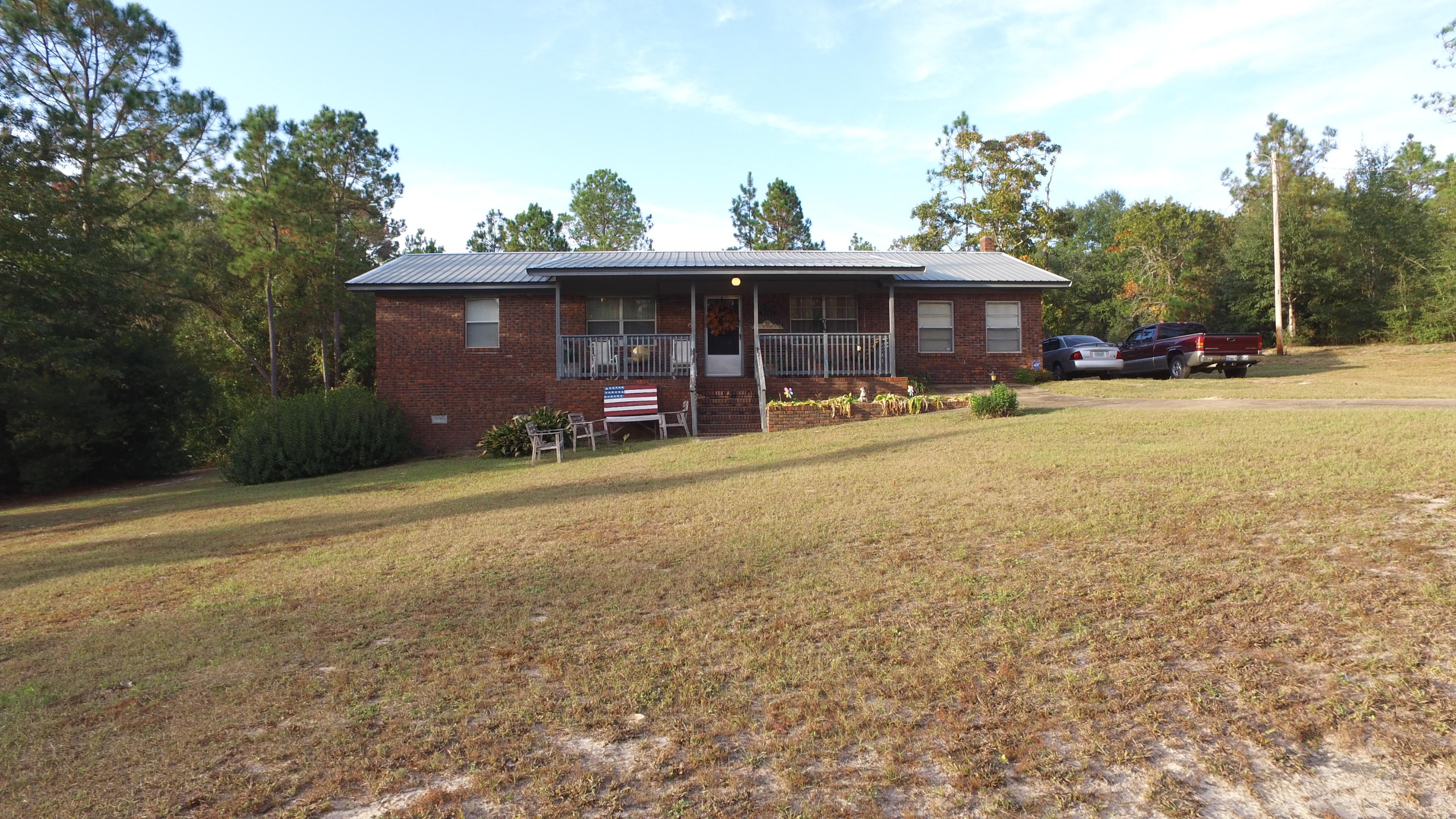 Over 2.5 acres of privacy, private pond, 3bd home with an office and bonus room! The surroundings are relaxing and the perfect front porch to sit, relax and take it all in. And guess what else? An unfinished basement (dirt floor) for added storage! Part of the acreage was used to house a mobile home and does have an existing 2nd septic tank (condition unknown), Private road access on the back of property off Mayhair. Laminate flooring added as an update throughout home. Office could easily be used as a nursery or 4th room, just lacks closet. Bonus room is HUGE! Currently used as formal dining and 2nd living area. Metal roof installed in 2003. Large indoor laundry room and added storage. Water heater and flooring installed 2007. Whole house fan does not operate. 1 yr AHS warranty included