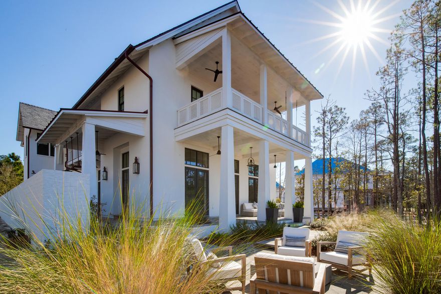 This stunning bay view home located in Churchill Oaks is designed by Savoie Architects with unparalleled coastal style and finish level. The main residence offers 3 bedrooms, 3.5 bathrooms, 2-car detached garage, and a 1-bedroom, 1-bathroom carriage house. Extraordinary finishes through ought this home include reclaimed hardwood flooring throughout, tongue-and-groove ceiling, white brick accents, custom tile, quartzite counters, white shaker style cabinets, designer light fixtures + more. Enjoy quiet evenings on the wide covered porch with a fire pit gorgeous views of the Bay. The courtyard situated right off the expansive kitchen offers an outdoor dining area with a summer kitchen and beautiful water features.