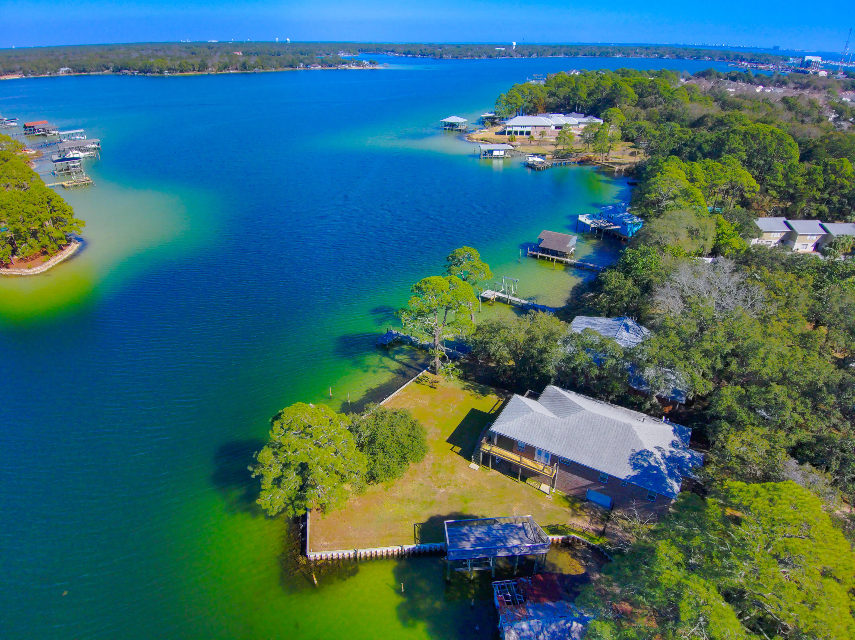 Breathtaking Waterfront Retreat with Two Docks & Panoramic Views!Discover the ultimate waterfront lifestyle with this stunning property featuring over 200 feet of pristine waterfront and unobstructed panoramic views. Whether you're a boating enthusiast or simply love the tranquility of the water, this home offers two private docks, including a two-story dock with a boat lift and deep-water slips, perfect for large vessels or multiple watercraft.Step inside to find a beautifully designed home with recessed lighting, rich hardwood floors, and elegant Tray ceilings. The open-concept layout seamlessly blends indoor and outdoor living, highlighted by four sliding glass doors that create a truly immersive experience. The kitchen is spacious, featuring granite countertops, stainless steel appliances, and a pantry with ample storage.
Located just minutes from Eglin and Hurlburt Air Force Base and only 10 minutes to the stunning waters of the Emerald Coast, this property offers both convenience and serenity. Perfect for paddleboarders, kayakers, and nature lovers, it provides direct access to our beautiful bays and bayous for endless water adventures.
Currently operating as a successful short-term rental, this property generated $90,602 in gross rental income in 2023 and $76,569 in 2024, making it an incredible investment opportunity. Property is being sold fully furnished with the right offer!
Whether you're looking for a luxurious primary residence, a vacation getaway, or a high-performing rental property, this waterfront gem is a rare find. Schedule your private showing today and experience the best of coastal living!