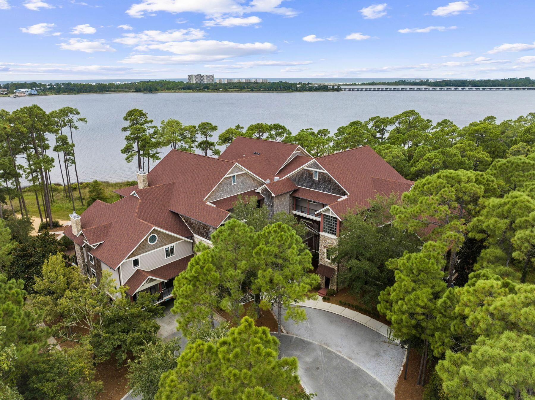 Newly renovated Lakeside Lodge condo along the shores of the largest coastal dune lake in Florida. Amenities include a new 30 slip boat facility plus easy private member access to Sharks Tooth Golf Club, the new Davis Love course, and skeet range. This charming two-bedroom, two-bath condo in the community of Wild Heron boasts 1,301 square feet of beautifully renovated pristine living space. Fresh, new upgrades include tile flooring throughout, new countertops, recessed lights, kitchen & bath faucets, and fresh paint throughout. Indulge in modern comforts in this bright condo home. The lodge building has undergone an entire re-roofing. The living room and master suite open onto an inviting lengthy private balcony overlooking Lake Powell. In Wild Heron, you can access resort-style amenities, guarded gate entry, walking trails and limited gulf access. Residents enjoy a dynamic social scene featuring food trucks, holiday events, and engaging activities. This exciting activity filled community has much to do and enjoy!