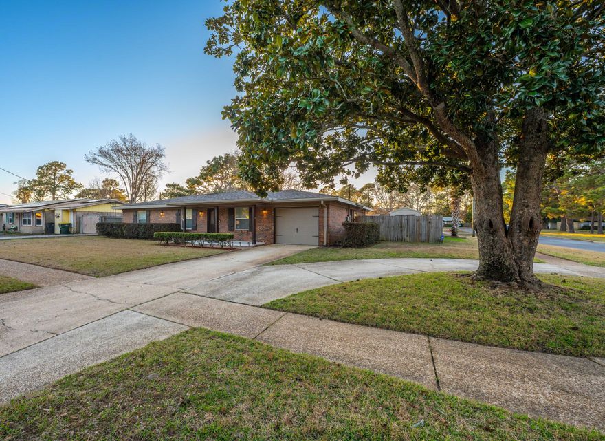Entering your established, all-brick rancher, note the crown molding in the living room and wood-look tile flooring.  The kitchen features touches like exposed beams, custom wine rack and shelving, exposed brick backsplash and double door access to the covered back patio and pergola with views of your privacy fenced backyard, private in-ground pool and large patio.  Off of the kitchen, at the rear of the home, is a second living area/den with built-in shelving and access to the large laundry room, which can double as an office / craft area with custom cabinetry, bead-board wainscoting, built-in desk and access to the garage.  On the other side of the home, is a long hallway leading to the freshly carpeted bedrooms and full guest bath with marble topped vanity,