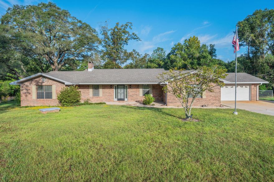Experience the best of both worlds with this stunning all-brick 3-bedroom, 2-bath home offering peaceful country living just minutes from town! Enjoy county zoning with no city taxes on 4.65+/- beautiful acres surrounded by majestic oak and pecan trees. The property features a barn, workshop, covered storage areas, and even a crystal-clear pond stocked with bream and bass--perfect for relaxing afternoons or outdoor adventures.Inside, you'll find a spacious living area centered around a cozy wood-burning fireplace, ideal for gathering with family and friends. The home includes a main kitchen and an additional canning kitchen in the laundry area for extra convenience. The master bedroom offers a garden tub, walk-in shower, and double vanity, providing a peaceful retreat. Step outside to the screened-in porch or open grilling porch overlooking the pondan ideal space for entertaining or enjoying quiet country sunsets. Recent upgrades include a new roof, hot water tank, and updated A/C system.
With plenty of space for your boat, RV, tools, and toys, this property combines rural charm, modern updates, and unmatched convenience. Don't miss the chance to make this slice of country paradise your home!