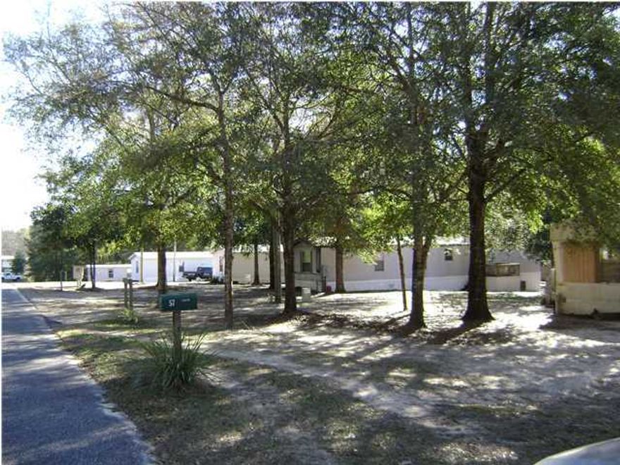 9 mobile homes plus a large workshop are located in this Mobile Home Park. All units are in good condition and are occupied!! There are a total of 6 water taps, and 6 septic tanks. 3 lots have 2 units and 3 lots have 1 unit. The storage building is a total of 1,100 sq ft with electricity, water heat and cool plus half bath. Materials in workshop will stay. Seller will finance with 30% down, terms negotiable. Licenses are current. Located in the Juniper Lake Area with boat launch by.