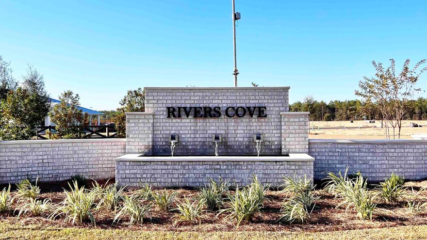 The charming Rivers Cove community offers residents use of it's gorgeous Community Pool, Community Room and Play ground.  The ''Sullivan'' plan is a cozy cottage style home with no wasted space, a desirable open design for relaxed living. A stylish 4 bedroom, 2 bath home, plus a large storage room. Easy care beautiful wood look flooring, delightful kitchen with stainless appliances, quiet dishwasher, smooth top range, built in microwave and pantry. Also included is Fabric hurricane door/window protection and a Smart Home 'Connect' system with several convenient Smart Home Devices.  MUST SEE.