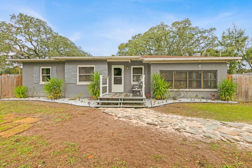 Gorgeous 3 bedroom home on a corner lot, centrally located, close to Hurlburt, Eglin AFB, downtown Fort Walton Beach, schools and beaches. Amazing location in a very family friendly neighborhood!French doors connect the dining room and living room, opening to a bright living area with crown molding, a beautiful fireplace and tile flooring throughout. Enjoy great updates such as; new tankless water heater, updated kitchen cabinets and appliances. All bedrooms have tile floor and ceiling fans, bathroom has a tub/shower combo. Outside laundry room that can also be used for storage. Lots of parking as well as a spacious yard surrounded by a newly built fence. All furnishings are negotiable to be included.