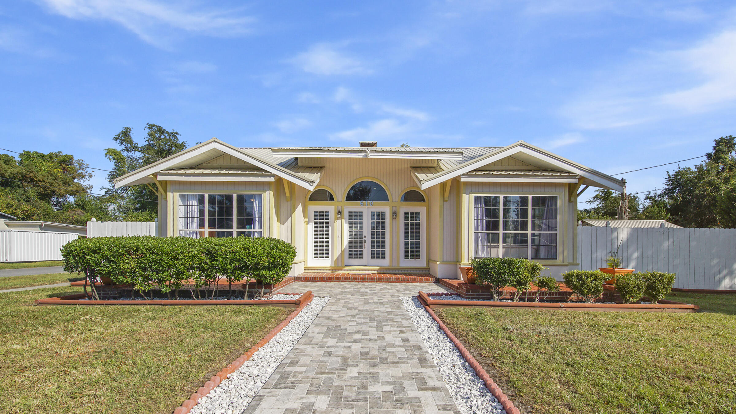 Rare Find! 1926 Unique 4 Bed/2 Bath home on a Large Corner Lot, close to downtown, shopping, hospitals, public boat ramp, Tyndall AFB. Primary Bedroom and 2nd Bedroom on first floor-split plan. Upstairs bedrooms have private stair entrances. NEW A/C, water heater, privacy fence, luxury vinyl plank flooring, granite kitchen countertops, bathroom vanity, paint inside and outside, ceiling fans, lights, crown molding, entrance pavers, and custom built storage shed. Beautifully landscaped. Private parking on the side entrance into the backyard and carport. This is a true GEM. MUST SEE!
