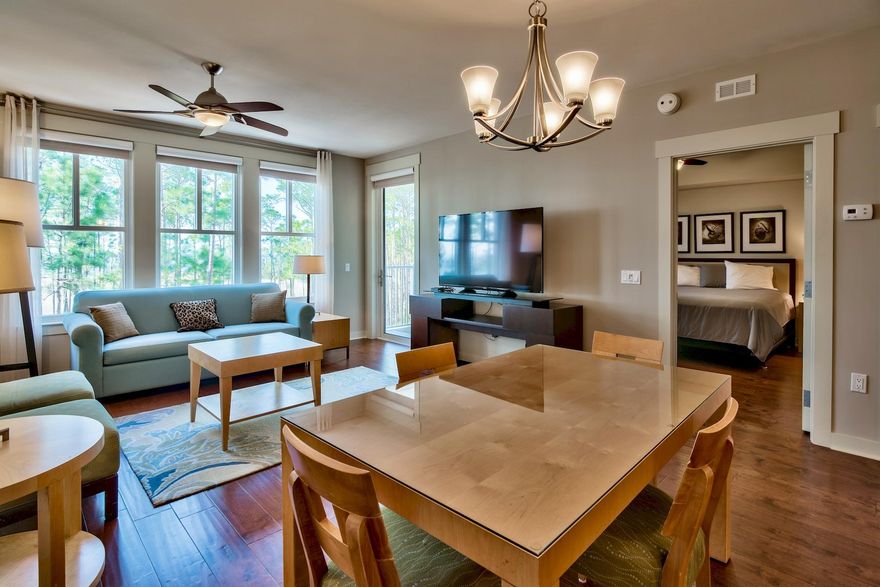 Enjoy spectacular sunsets over the bay from your private balcony while watching wildlife graze in the natural landscape below. This recently upgraded property in the stylish Bahia building offers incredible enhancements including hardwood floors, 'Smart' TVs and custom closets. You will understand the true meaning of vacation as you relax in the open floor plan with comfortable living room, generous dining area and upscale kitchen with granite countertops. Seller is also offering the new owner a home warranty through September 2018.The pool and formal gardens are a pleasant stroll from your doorstep. Beautifully designed, Bahia sits in the Village of Baytowne Wharf on the lavish grounds of Sandestin Golf and Beach Resort. This waterfront community offers upscale dining, boutique shopping,