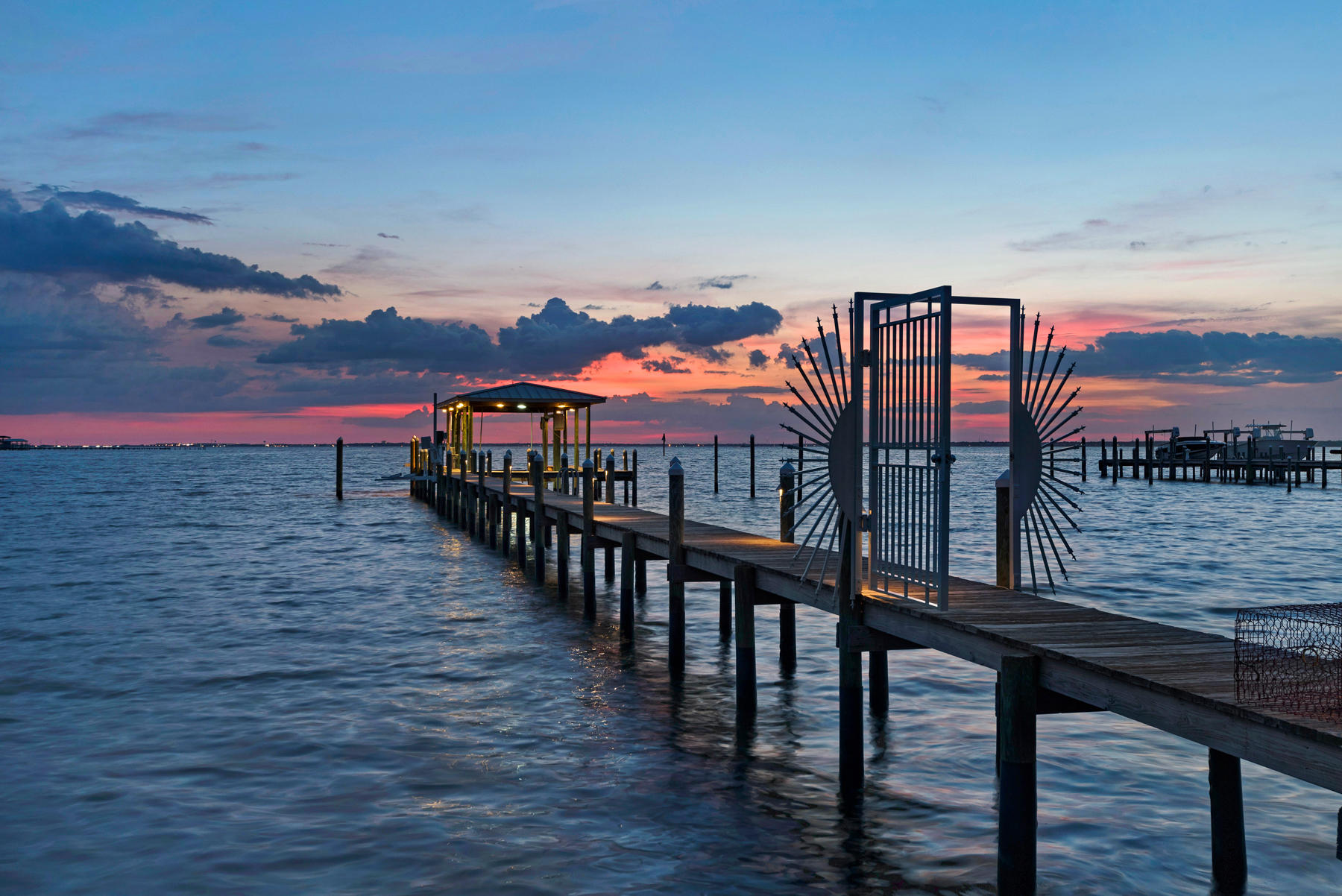 Property under contract with 72 hour Kick-out clause. This breath taking home and property is situated on an estate sized lot and quiet cul-de-sac, with 165 feet of water frontage at the mouth of deepwater Joe's Bayou and Choctawhatchee Bay. A gentle curving driveway leads to an impressive entrance reminiscent of a Key West Home with expansive water view from main living area, including the kitchen and dining room. This home features refinished solid wood floors, granite Kitchen countertops, large wet bar off main living area featuring a new Wine Cooler, Ice Maker, & cabinets. Luxurious master bath with travertine, Jacuzzi tub, walk-in shower, outdoor CalderaSpa, Indoor/Outdoor surround sound Sonos System.