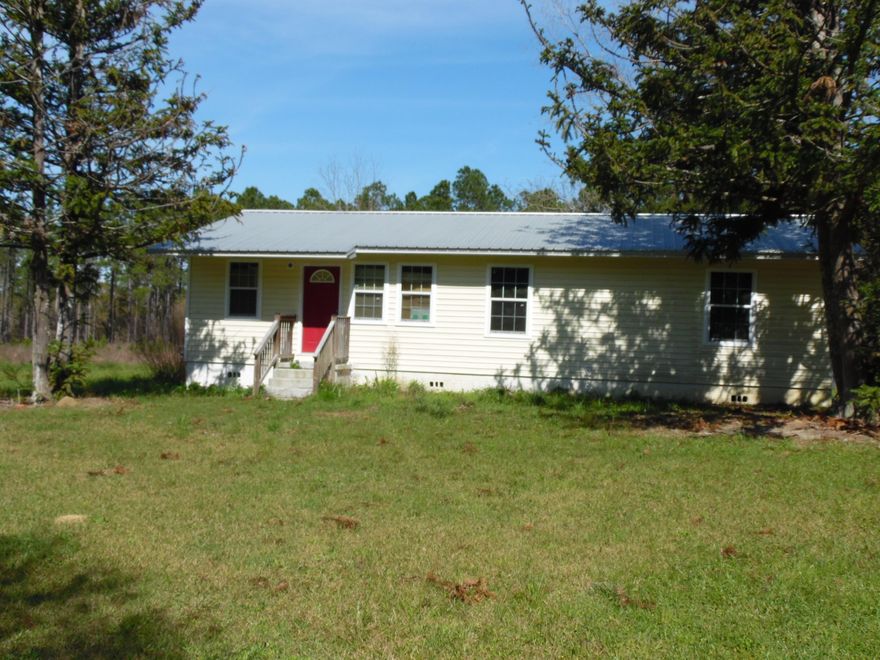 GREAT FIXER UPPER! with 3 acres. Seller has made several renovations such as new metal roof on 2012, treated for termites 2012, sheetrock walls installed, needed to be taped and finished. New windows and ceramic floors installed. There is no heating and air system. Just rough wired and line set. The wiring was replaced from aluminum to copper, and is currently rough-in state, needing correct breakers installed for current code. Plumbing is uncomplicated rough-in. Under house needs to be completed, and bath when fixtures are determined. It was being done in PVC waste and PVC fresh water. This will need to be a CASH purchase. Has well and septic tank, all on 3 beautiful acres with pecan trees and a well established lawn.CASH sales contracts only due to necessary renovations.