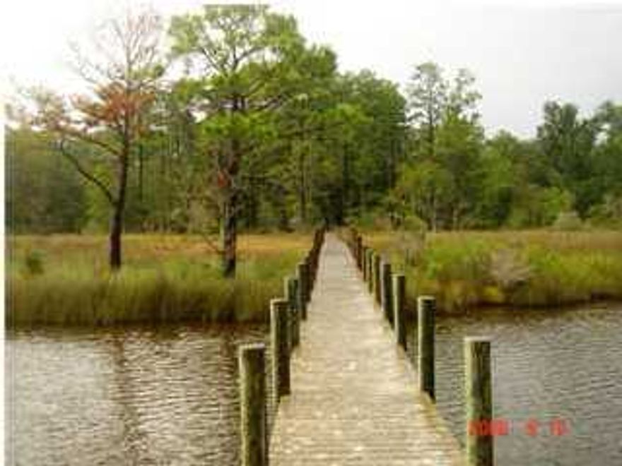 A beautiful lot with mature trees with a dock in place on LaGrange Bayou. This is an excellent site for your dream home overlooking the beautiful, wide and Deep LaGrange Bayou. Enjoy the serene enviroment with a spectacular waterview and deep water access to the bay.
