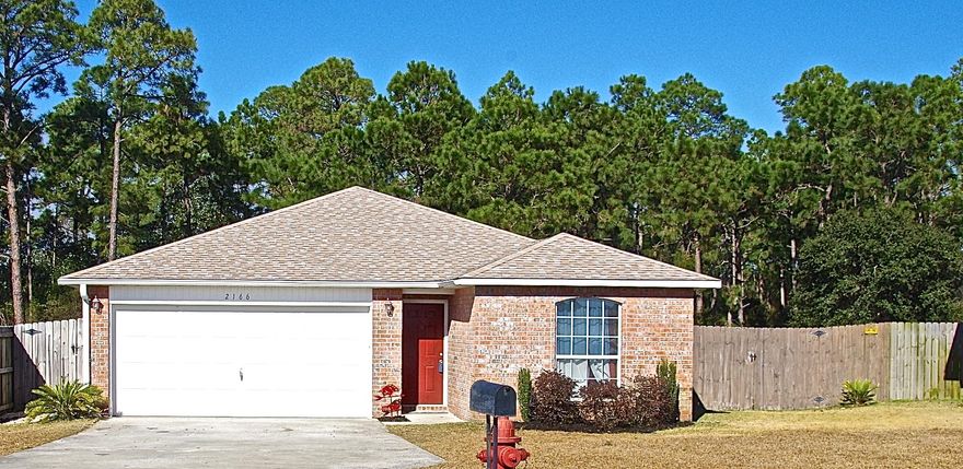 Cul-de-sac home located in a beautiful neighborhood in the heart of Navarre. This 4 bedroom house is perfect for someone wanting a HUGE yard and lots of space. The master bedroom has an added bonus room that could be used as an extra small bedroom, office, or exercise space. New laminate flooring (2016) throughout the main living space. New laminate just installed in master bath 2017. Open floor plan and two car oversized garage. The front of the house has two bedrooms with a bathroom in between. The living room, dining room and kitchen is central to the home with high ceilings and plant ledging. The kitchen has matching black appliances and a flat top stove. Two more bedrooms are located off of the living room. The bonus room, connected to the master bedroom, has sliding doors to the yard The master bath has his and her walk in closets. Dual vanity sinks, garden tub, and shower completes the master bathroom.  All the carpets have just been cleaned and look fantastic with fresh painted baseboards and rooms throughout the house.  This home is close to both Hurlburt Field and Eglin Air Force Base.  If it the beach you need, this home is located 2 miles from the white sandy beaches of the Emerald Coast. Come take a look at this amazing home. You will not be disappointed.

Hurricane shutters and hardware are located in the shed.  
Backyard shed and swing set convey "as is"
Black shelf will stay with home as well as the hanging shelf that supports 350lbs. of storage.