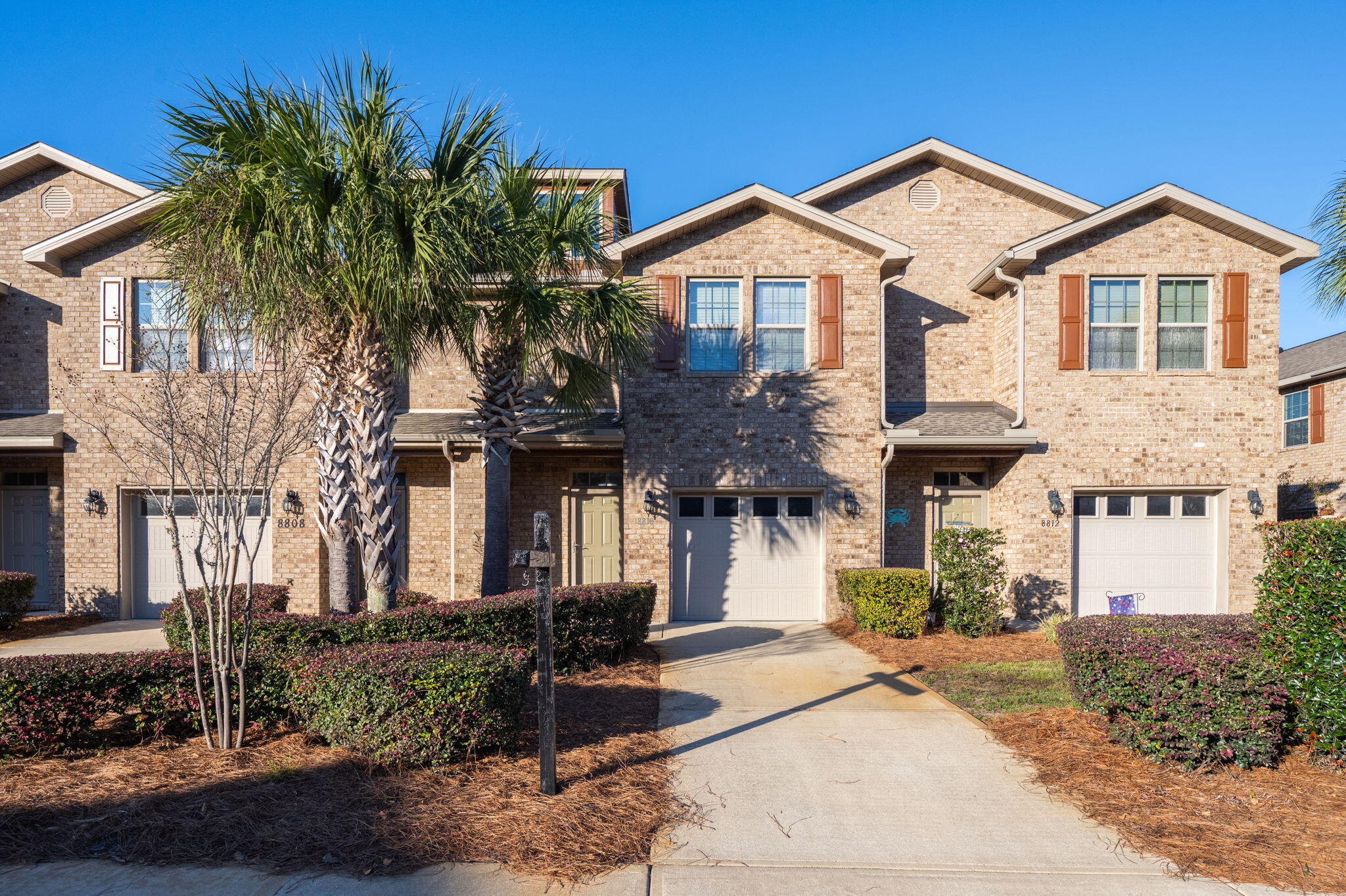 Welcome to 8810 Brown Pelican Circle, Navarre, FL--a stunning townhome located in the highly desirable Reserve Pointe community. Situated just 4 miles from Navarre Beach, 13 miles from Hurlburt Field and just 36 miles from Pensacola Beach. Reserve Pointe's amenities are designed to enhance lifestyle, with a resort-style swimming pool, a playground, and maintained landscaping. Whether you're cooling off at the pool or enjoying the nearby attractions, this community offers something for everyone. 

This beautiful townhome features wood-look vinyl flooring on the main level, blending durability with style. The kitchen is outfitted stainless steel appliances, granite countertops, a contemporary backsplash, and rich cabinetry. The open floor plan provides a bright and inviting living area, ideal for both relaxing and entertaining. A convenient half-bathroom is located on the main floor.

Upstairs, the spacious master suite is a private retreat, featuring an en-suite bathroom with a double vanity, granite countertops, and a walk-in shower. A second full bathroom, complete with a shower/tub combo, serves the other bedrooms.

The outdoor space includes a fully fenced backyard with a tropical palm tree, offering privacy and a relaxing atmosphere. Thoughtful upgrades, such as a water softener, storm doors, and a new back door with built-in blinds, ensure comfort and convenience.