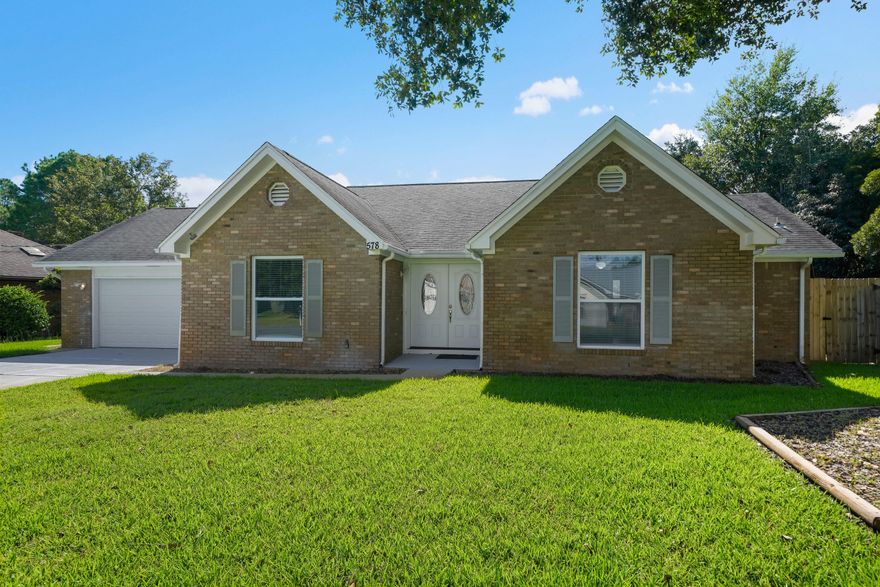 Great location 2.5 miles from Hurlburt Field entrance. This home features large bedrooms, closets, kitchen and dining room. The living room features a cathedral ceiling and stone wood burning fireplace. The garage includes work areas and floored attic space. Enjoy the view of the lake from your  screened patio. The homes sits on a small lake and is great for paddle boats and canoes but no motor boats. All measurements to be verified by buyer before closing.