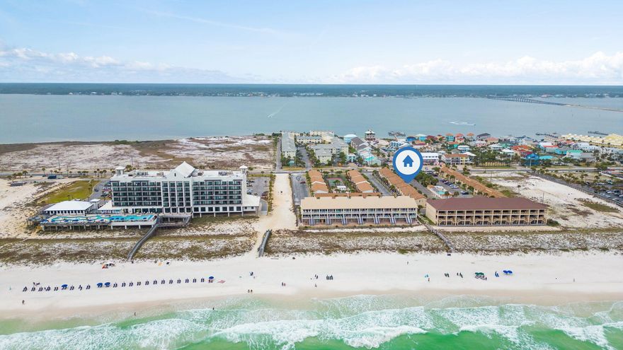 Welcome to a rare opportunity to own a vacation home that is steps away from the Gulf side white sandy beaches and turquoise waters. 
Look at the ROI on this unit WOW!!!! In 2022, the unit grossed 45,282 per year while the owner also came and occupied often. Gross numbers for 2023 are climbing as well. Please ask for the rental mgmt documents to show these exact figures. In 2021, the unit grossed 39,933 that year, so you can see how the figures keep climbing as Navarre Beach seems to be the fasted growing vacationer destination.  This remarkable town home is a two story that features 2 large bedrooms and three bathrooms total. The home also has a laundry room so you don't have to travel for miles to find a laundry-mat. The privacy is incredible because you also get your own backyard fenced area with a concrete table that conveys. The entire home has been well kept and all the furniture and appliances will remain with the home purchase. The town home gets a ton of bookings non stop so showings will be sparse so call in advance for a private showing. 

Downstairs as you enter the foyer, you will notice a full sized kitchen with plenty of natural lighting leading to the dining area and an oversized living room for guests. You will always feel connected downstairs with the open layout. There is plenty of cabinets and closets for storage and the bedrooms are located up stairs. 

The HOA has recently replaced the roof already and the home owners has done minor updates throughout the inside of the home, including the new LVP flooring. 

The home will include the rental bookings for you to inherit if you would like. Please add that in your offer in case this is going to be a rental money maker for yourself instead of a private residence. 

You will also appreciate that the pool is right out your front door as you will see in the drone photos. The opportunity of walking to the beach or the pool is all you could ever ask for. Sugar Beach town homes are rare to be available, so grab your GEM on the beach today! No multiple stairs, traffic or hot elevators to worry about. Just get the keys to your beach home and walk right inside!