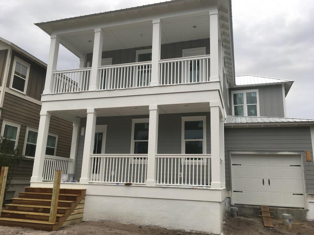 This home on Lot 7 is currently under construction and offers two master suites. Beautiful beach home with four bedrooms and 4 baths and a powder room. This home would make a great full-time, vacation home or rental with a master suite downstairs and up. Stainless steel appliances, granite counter-tops, tile in baths and laundry, wood floors in main living areas, master bedroom downstairs, media room, second floor hallway and stairs. Tank-less water heater, gavalum metal roof.More pictures will be added as construction progresses.