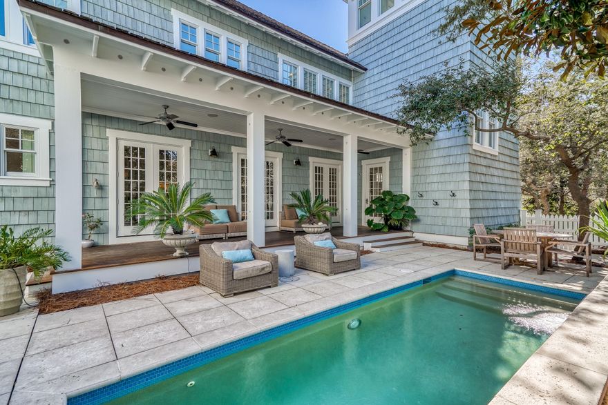 Bright sunlight streams into impeccably designed spaces at this custom WaterSound Beach masterpiece. Designed by Geoff Chick & Associates, this stunning residence is just steps from the Gulf of Mexico.The larger corner location allows for multiple outdoor spaces including three covered porches which create idyllic places to soak up the warm Gulf breeze.Luxury finishes & features were carefully selected to embody a classic coastal style including recently refinished reclaimed pine floors, shiplap walls, coffered ceilings & upgraded lighting. The chef's kitchen is beautifully appointed with professional-grade appliances, marble countertops & new custom stove hood. Vaulted ceilings, a tabby shell fireplace & the multitude of windows allow in the natural light highlighting the living room. The master suite provides a peaceful retreat with a sitting area & spacious master bathroom with soaking tub & separate shower. A secondary living area with beverage bar & built-in shelving is located on the first level & is the perfect spot for the kids to hangout. Relax in the outside sanctuary and enjoy the pool with water feature, the covered porch & spacious pool deck.  The oversized carriage home over the 2 car garage offers a living & sleeping space, kitchenette & full bathroom.
The gated community of WaterSound Beach offers homeowners a rare sense of seclusion with easy access to all area activities. Amenities include two swimming pools, multiple parks, green spaces, a fitness center & private boardwalks that lead to the mile of gulf front & 90 acres of sugar sand dunes. Don't miss this rare offering!
