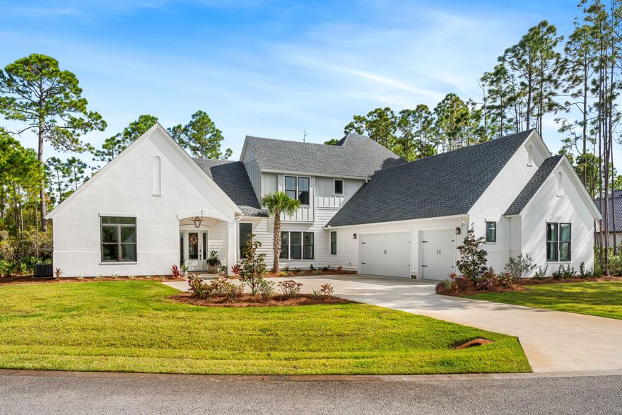 Welcome to 489 Hideaway Circle, an exquisite like-new 2023-built masterpiece nestled on a serene half-acre lot within the prestigious gated bayfront community of Seclusion Bay in Santa Rosa Beach. This luxurious home boasts 5 bedrooms, including both upstairs and downstairs guest suites, offering exceptional privacy and comfort for family and friends.Thoughtfully designed with high-end finishes, this residence features white oak hardwood flooring, quartz countertops with waterfall edges on the island, and premium stainless steel appliances. The main floor includes a separate wet bar and a butler's pantry--perfect for entertaining. Upstairs, a secondary gathering space on the landing creates a versatile retreat, while pops of designer wallpaper throughout add a touch of personality... and warmth. Enjoy movie nights in the dedicated theater room or take advantage of the expansive backyard with ample room for a custom pool. Abundant natural light floods the living spaces, creating a peaceful and welcoming atmosphere throughout. And the three-car garage even includes a conditioned storage closet for added convenience. This low-density, family-friendly community is comprised of only 53 estate-sized lots, ensuring a quiet, exclusive setting. Residents in Seclusion Bay enjoy access to a community dock on the Choctawhatchee Bay for fishing, paddle-boarding, and kayaking, along with mesmerizing bayfront sunsets- ensuring MAXIMUM family memories. Centrally located near 30A's renowned beaches, top-rated schools, and scenic state parks, this home delivers the absolute best of coastal living.