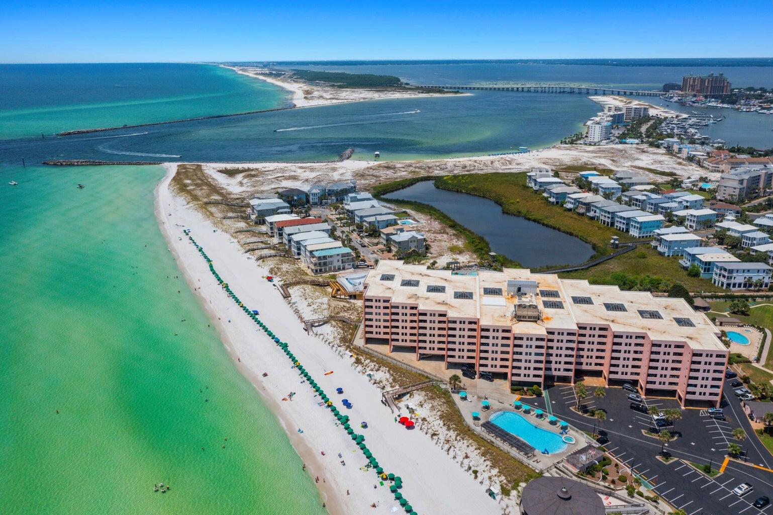 Looking for a beach front condominium that has it ALL, location, a great price and impressive rental history? Look no further! This oversized 1BR/1BTH unit on Destin's Holiday Isle is one of the largest one bedroom floor plans in the beautiful gated community of Jetty East. New HVAC was replaced in 2024. Sit on your large balcony and enjoy the emerald waters and breathtaking sunsets! Relax at the beachfront pool/hot tub, play tennis or pickleball or watch the boats going in and out of the Destin Pass. The Harbor, nearby, is home to some of the best seafood restaurants and shopping in the area! Don't miss this opportunity to own your personal getaway or investment property on the sugar white sand beaches of the Emerald Coast!