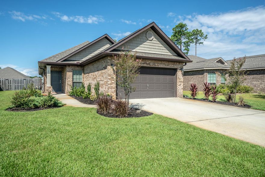 This immaculate three bedroom, two bathroom brick home with a private enclosed lanai and additional paver patio is full upgraded and move in ready. This beautiful home was built in 2014 in the friendly neighborhood of Driftwood Estates and has been magnificently maintained. It boasts a spacious open floor plan, with a great kitchen featuring plenty of cabinet storage and counter space, stainless steel appliances, and breakfast bar. Finishings include hardwood flooring, granite counter tops, dark wood cabinets, and chrome fixtures. The large master bedroom features a walk-in closet, en suite bedroom with walk-in shower, soaking tub, and lengthy double vanity. Community pool across the street. Same day showings available with a few hours notice. Hot tub does not convey.