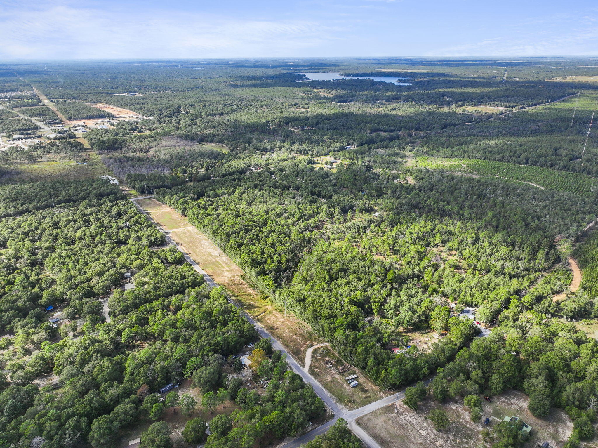 5.26 Acre Lot for Sale in The Plantations. No HOA. Gas, electric, and water available to be connected nearby. Not currently connected to property however. 2 Miles to historic downtown Defuniak Springs (shopping, restaurants, municpal buildings).
