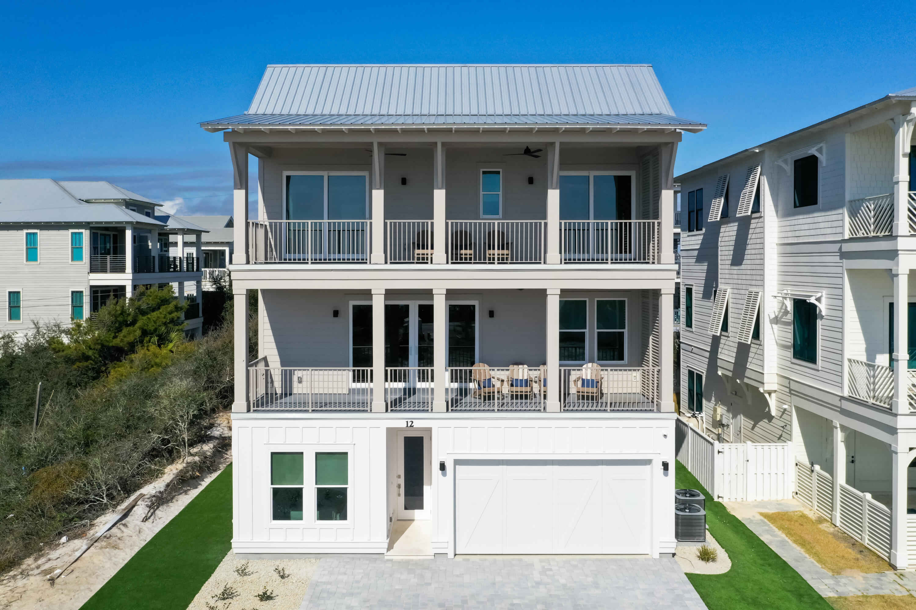 Discover the epitome of luxury coastal living at 12 Jan Court, a breathtaking home in the highly desirable Inlet Beach community. Designed with sophistication and comfort in mind, this property boasts six spacious bedrooms and six full bathrooms, making it the perfect retreat for families and guests alike.The 2nd-floor living area maximizes breathtaking Gulf views, creating a serene backdrop for gatherings or quiet moments alike. Expansive windows invite an abundance of natural light, seamlessly connecting the indoors with the beauty of the surrounding environment. The gourmet kitchen, equipped with premium appliances and refined finishes, makes hosting effortless, while the open-concept floor plan ensures every space feels connected. The first floor offers a cozy family room, ideal for gathering and relaxing after a day at the beach. Step outside to your private pool, a serene outdoor oasis perfect for cooling off, soaking up the sun, or hosting lively poolside gatherings. This additional living space ensures the home is as functional as it is beautiful, catering to every lifestyle.
Each bedroom is a private oasis with luxurious en-suite bathrooms that combine functionality with refined design. This home seamlessly blends coastal charm with modern elegance, offering style and comfort at every turn.
Located just steps from the Gulf's sugar-white sands and emerald waters, 12 Jan Court offers unparalleled access to the best of Inlet Beach. Whether enjoying the views from your private balcony or exploring the vibrant local scene, this property offers a lifestyle that is as relaxing as it is exhilarating.
