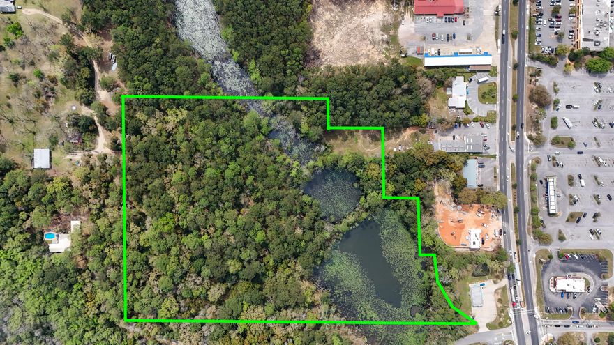 This exceptional 15 ACRE COMMERCIAL property, ZONED C2, is strategically located just off US HWY 331S, across from WALMART and less than 1 MILE NORTH OF I-10, in the rapidly growing area of DEFUNIAK SPRINGS, FL. With convenient traffic light access from Corbett Drive and clear visibility from 331, this property offers unparalleled potential for a variety of commercial ventures.Offering 15 ac +/- altogether, with approximately 10 ACRES UPLANDS (mostly level), plus additional natural features including a beaver pond and creek. C2 ZONING allows for diverse uses such as hotels/motels, apartments, retail stores, professional offices, banks, restaurants, auto dealerships and more. Easily seen from Hwy 331, the sellers have added an additional opportunity for a 331S MONUMENT SIGN. Flexible options include subdividing the property into 2, 3, or more parcels to suit your specific needs. Sellers are creative and willing to consider various, serious proposals. Whether you're looking to develop a single-use project or a mixed-use complex, this property can accommodate your vision. A completed HOTEL/MOTEL FEASIBILITY STUDY is available for review for serious buyers. With access to electric, city water and city sewer, this property is poised to be a project with the pieces of the puzzle needed for a straightforward start.

The natural features and layout of the property also provide numerous opportunities for landscaping and design. This is a rare opportunity to secure a prime piece of commercial real estate in a thriving market.