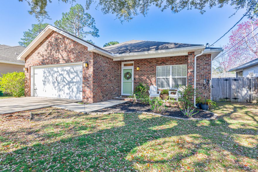 Brick-built, charm-filled home makes a lasting first impression featuring a spacious yard shaded by mature trees and cozy front patio perfect for unwinding. Inside you're greeted by a welcoming entry then soaring ceilings that opens up the space, giving the interior an expansive, airy feel. The heart of the home is the spacious kitchen equipped with granite countertops and pantry offering views of the living areas and generous backyard. A pocket door leads to the laundry room and double-car garage making everyday tasks a breeze. The fully fenced backyard includes a fire pit and a large screened-in patio for enjoying Florida's weather year-round. With three bedrooms, two bathrooms, ample outdoor space, and like new HVAC (2023) this home is the perfect place to create lasting memories. Within a 2-mile radius, you'll find variety of shopping, restaurants, fast food options, and grocery stores, making errands and dining out incredibly convenient. Plew Elementary Public School is just a 1.5 mile commute. For outdoor enthusiasts, the beautiful Rocky Bayou State Park is nearby, offering scenic views and walking trails. plus, you're just a short 20-minute drive from Destin's beautiful beaches and public amenities.