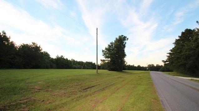 Beautiful flat parcel of land with over 1300 feet of frontage on Hwy. 602.
