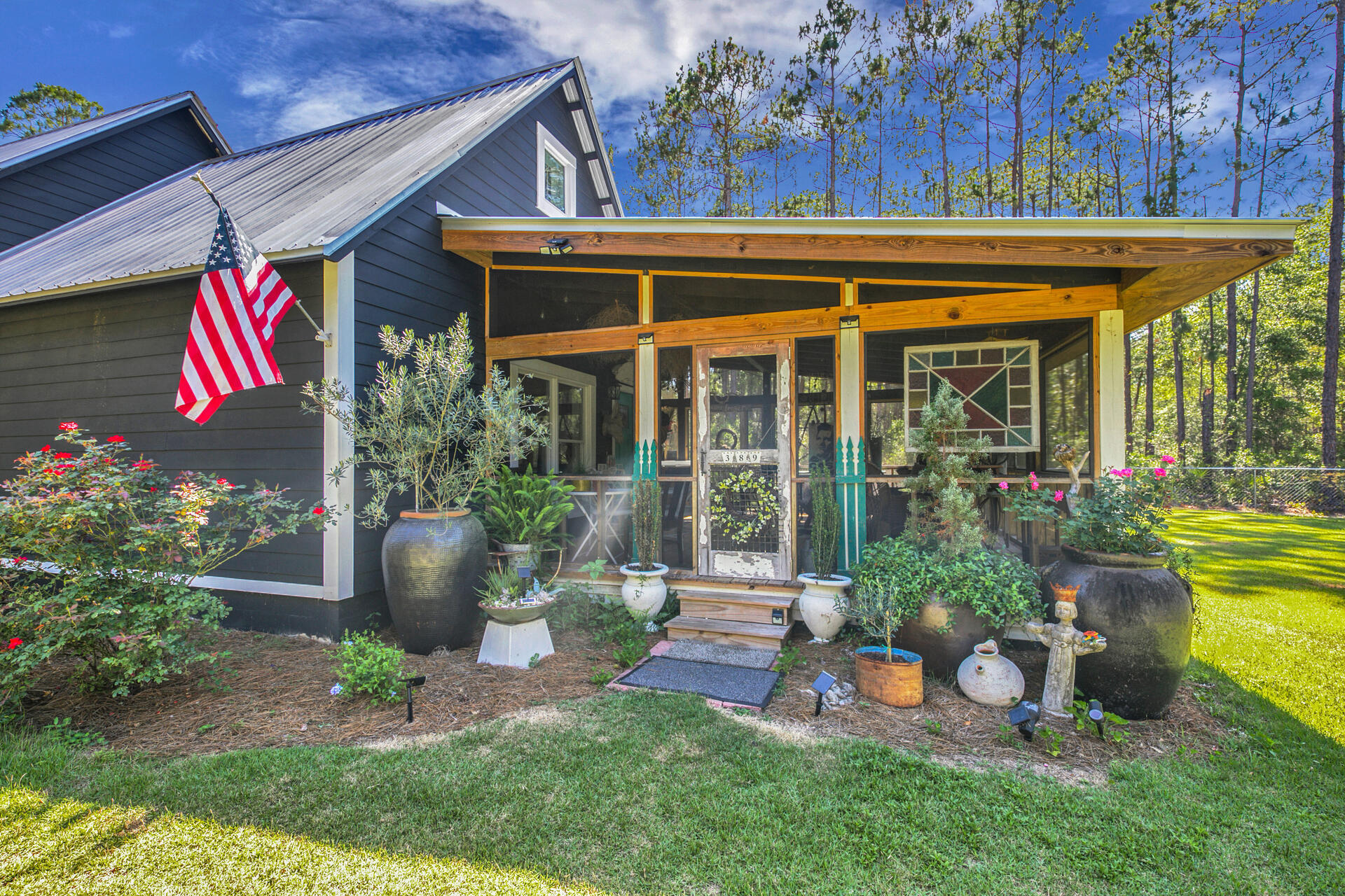 Modern farmhouse style concrete house on 1/2 acre. Beautiful rural setting 8 miles from the gulf of Mexico. 3 bedrooms, 1 1/2 baths recently renovated with all new paint, appliances, hot water heater. Fabulous screened porch overlooking an expansive lawn and citrus trees. Property is 90 % fenced and has a metal studio/workshop and carport on 6'' slab. There is an additional insulated storage building and plenty of room for chickens and a couple of goats! Laminate flooring throughout with scored concrete underneath. Beautiful subway tile, granite, and chandeliers throughout.