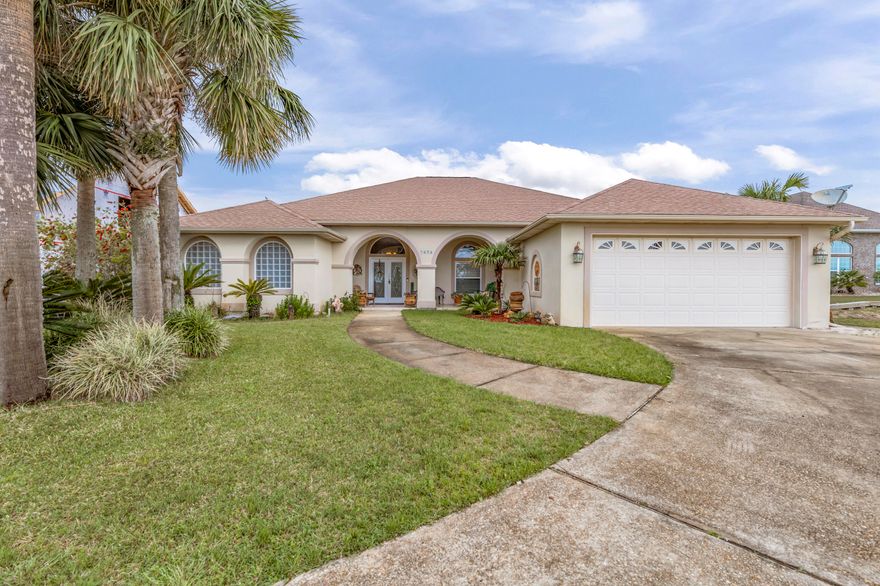 Beautiful, well built, maintained home in Villa Vizcaya subdivision.  Home sits in a cup-de-sac and has an expansion view of the Sound & Navarre Bch and  just steps away from the common boardwalk to the waters edge.   This amazing open floor plan invites you through the double French glass doors with tiled flooring throughout the home.  A formal living area greets you after you enter the home that has sliding doors that go out to the covered porch to enjoy the pool.  With this open floor plan, you can enjoy your family or guests while cooking, watching tv, enjoying the double sided gas fireplace and family room.  Your master suite is to your left which features a trey ceiling with dimmable lighting,  2 separate walk-in closets and doors leading out to the covered porch pool.