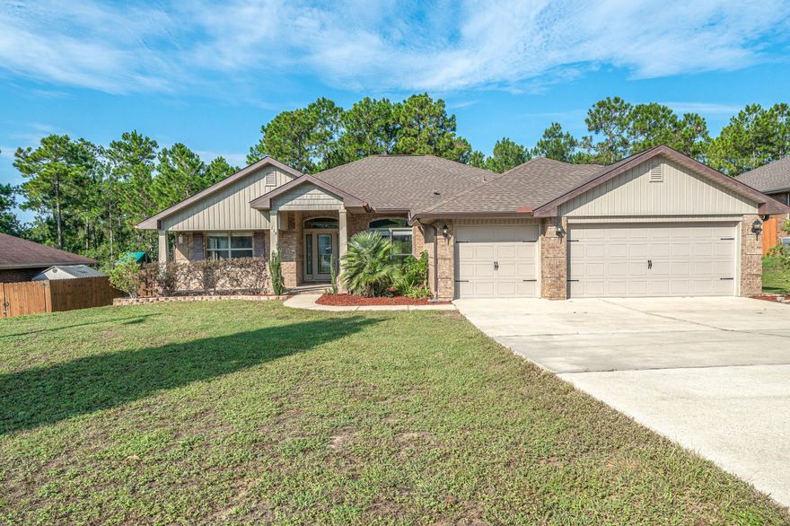 Come experience this freshly painted in ''Agreeable Gray'' 4 Bed/3 Full Bath/3 Car Garage all brick home located in sought after Alicia Place - South of I-10 with short commute to 7th Grp, Duke, Eglin AFB. The property welcomes friends and guests alike with a covered front porch. As you enter home you will notice the 10' ft ceilings, open concept dining/family room/kitchen area with access to a large covered back porch perfect for entertaining. There is a large flex room that could easily be used for office or kids play area. The kitchen features plenty of cabinets and countertop space for meal prep, stainless steel appliances, and breakfast bar. The spacious master suite features treyed ceilings, separate closets, separate vanities, stand up shower, and garden tub. The additional