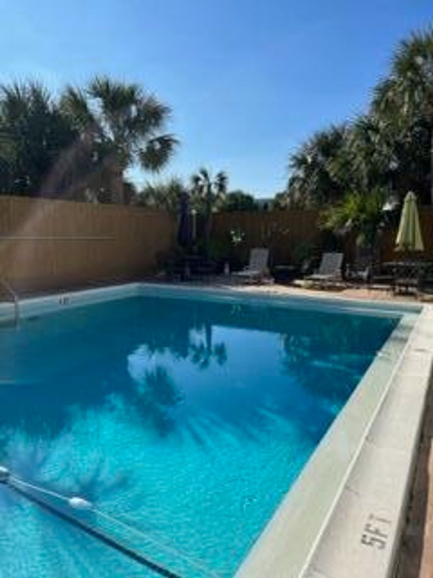 NEW ROOF, NEW AC, NEW HOT WATER HEATER. New copper wiring.   Absolutely Gorgeous townhome extremely close to the beach WTIH an association POOL!!  Update throughout.  Newer paint, kitchen cabinets and counter tops.  Beautiful fenced in back patio-great for entertaining and BBQ's.  Close to all the restaurants, boating activities, stores and bars (enjoy some local bands).  Just a few steps from the first beach access.  Location, location, location-Oh, did I mention the pool? yes, they have one. You will never want to leave home.