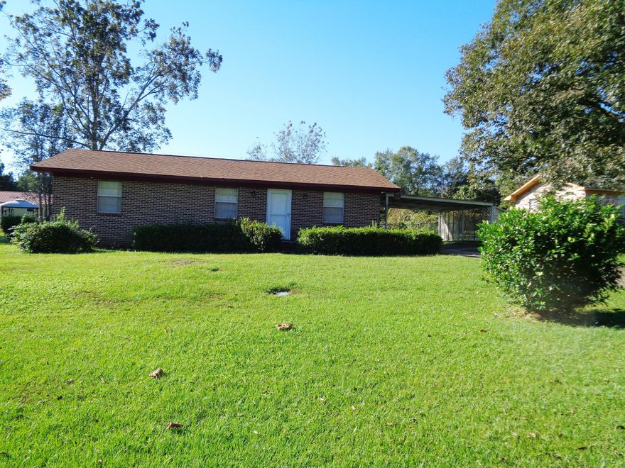 GREAT BRICK HOME LOCATED WITHIN THE CITY LIMITS ON A PAVED ROAD. HOME IS LIKE NEW TO INCLUDE A NEW ROOF, NEW CARPET, NEW TILE, REWIRED, NEW PLUMBING, NEW HOT WATER HEATER, NEW CENTRAL HEAT AND AIR, STORM DOORS, NEW APPLIANCES - THE LIST CONTINUES. SELLER BOUGHT HOME TO RETIRE IN AREA AND SKIPPED NO DETAIL TO INCLUDED TILED SHOWER AND TUB! THIS HOME IS PERFECT TO MOVE INTO AND START LIVING. NO UPKEEP WILL BE REQUIRED! FENCED BACK YARD TO INCLUDE AND STORAGE BUILDING!