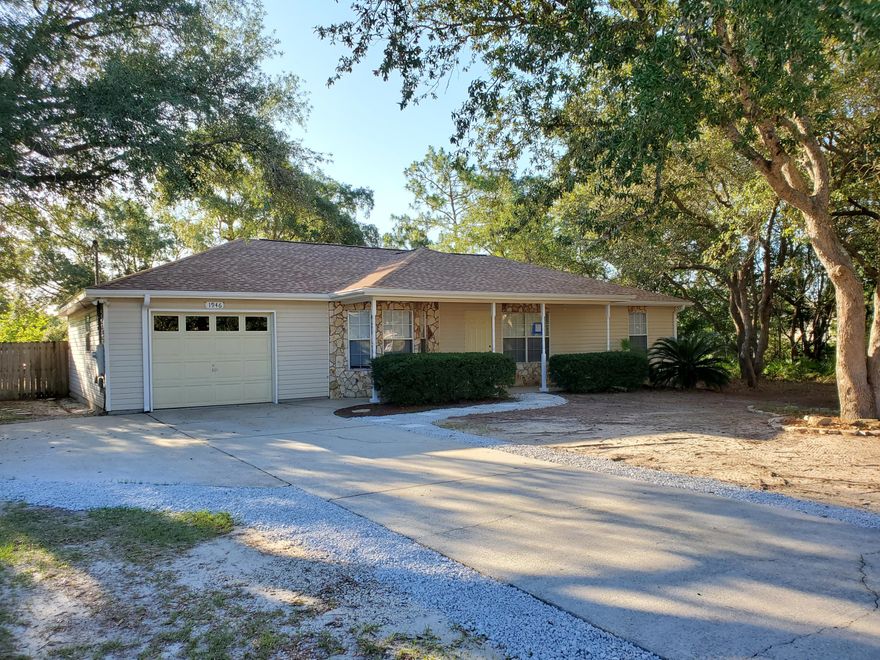 Look no further 4/2 under $250k with new roof, granite counters, new water heater, newer tile, newer carpet and fresh paint. This wonderful family home is situated in the heart of Navarre on just under 1/2 acre. You are only minutes away from shopping, bars, restaurants, and all the amenities you seek plus you can be at the beautiful Navarre Beach in about 5 minutes. A brand new 50 year roof was just installed along with granite counters in the kitchen and bathroom all with new sinks and hardware. The Living Room and Master Bedroom have high vaulted ceilings which make this 1,735 SF home feel roomy. Huge laundry 12 x 8.5 to supplement the oversized 1 car garage. The rear yard has plenty of shade trees and a nice sized screened in patio. The home is on public sewer. This will not last.