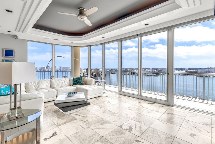 Come experience this contemporary three bedroom, three bath condo located right in the center of the Destin Harbor. With three balconies and floor-to-ceiling wraparound windows, this unit is a must-see for anyone looking for daily sunsets. The large wraparound 60-foot balcony provides spectacular views of the harbor, the Gulf of Mexico, and Destin's East Pass. This condo features an expansive, open floor plan with 2,265 sq. ft. all on one level. A custom spiral staircase leads to the private rooftop terrace with a summer kitchen and sunning deck...ideal for day or nighttime entertaining or simply relaxing in the privacy of your own rooftop space.